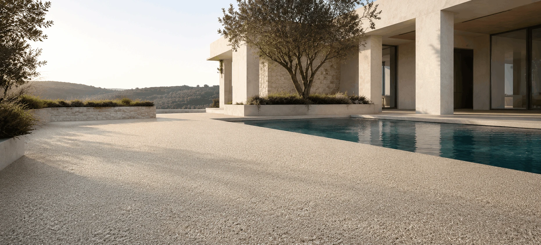 Co-Stone stone carpet flooring around a pool and outdoor terrace